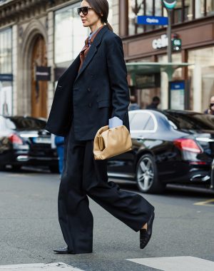 PARIS, FRANCE - SEPTEMBER 30, 2019: Julie Pelipas wears double-breasted jacket, oversized pants and sunglasses outside STELLA McCARTNEY show, during Paris Fashion Week Womenswear Spring/Summer 2020.
